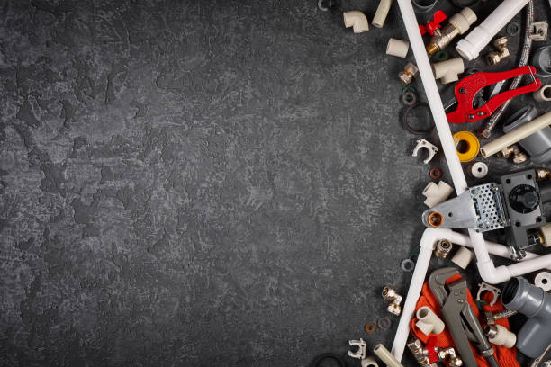 Set of spare parts and tools for plumbing works stock photo