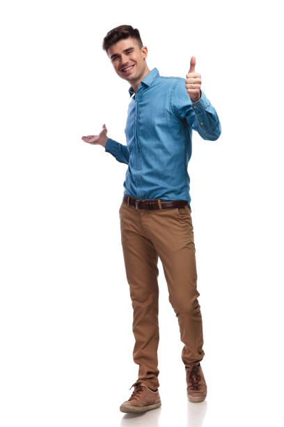 laughing young casual man presenting and making ok sign laughing young casual man presenting and making ok sign on white background ok sign photos stock pictures, royalty-free photos & images
