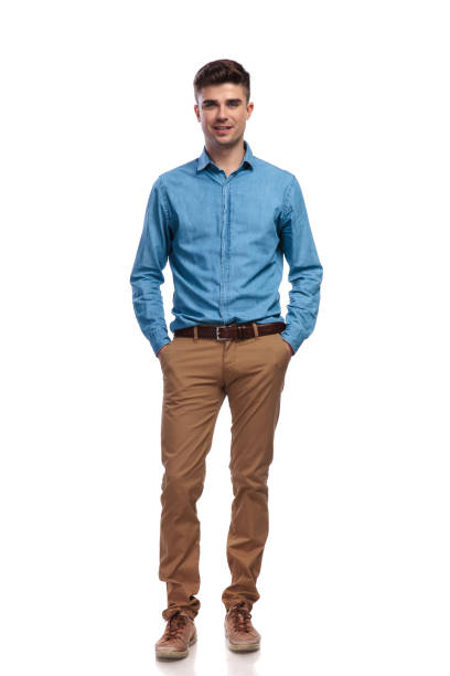 istock relaxed casual man with hands in pockets 935997208