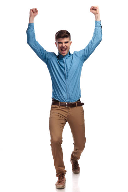 istock excited young casual man celebrating success 935997568