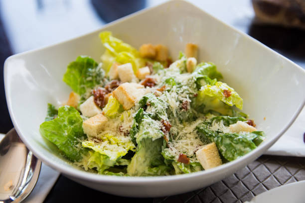 ceasar salad with bacon bits - side salad imagens e fotografias de stock