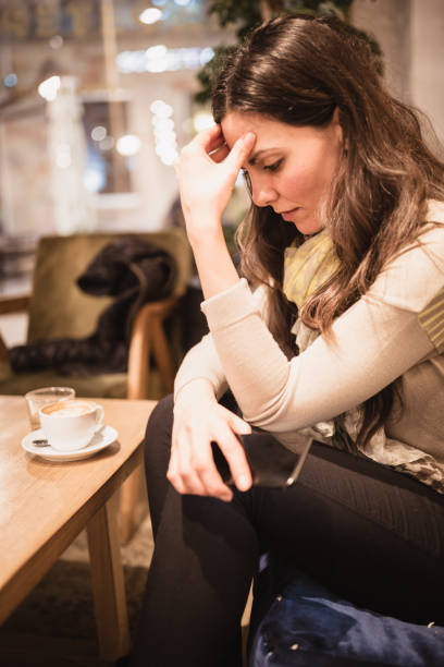 istock Single. Young woman enjoying coffee  in cafe 935997810