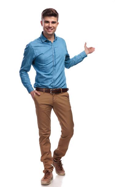 smiling young casual man presenting smiling young casual man presenting something on white background temptation stock pictures, royalty-free photos & images