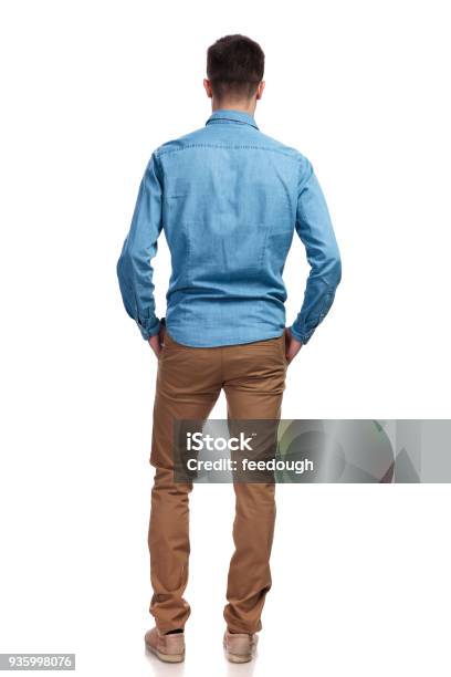 Back View Of A Man Standing With Hands In Pockets Stock Photo - Download Image Now - Rear View, Men, Back