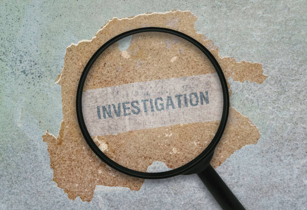 Single word Investigation Word Investigation written under a magnifying glass on grunge background military private stock pictures, royalty-free photos & images