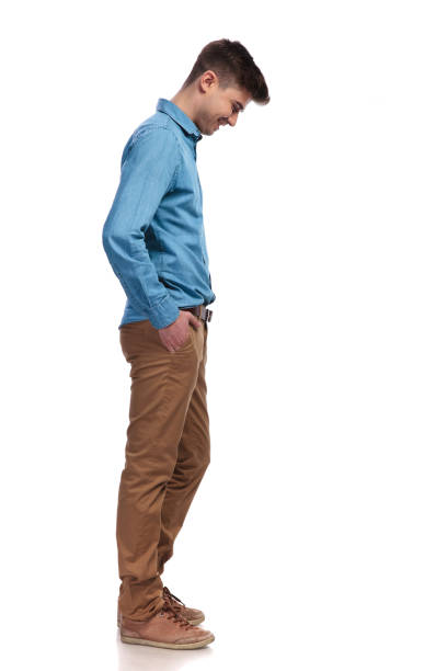 istock side view of a  casual man looking down at something 935998320
