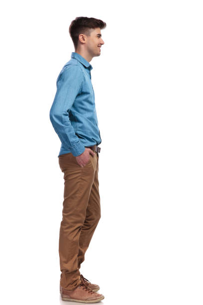 istock side view of a smiling casual man waiting in line 936000514