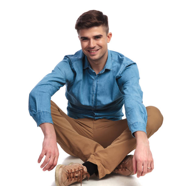 istock smiling casual man sitting and resting 936000534