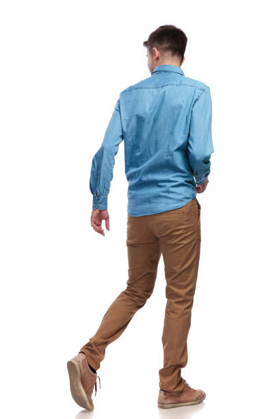 back view of a walking casual man looking to side back view of a walking casual man looking to side on white background shirt photos stock pictures, royalty-free photos & images