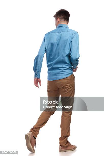 Back View Of A Walking Casual Man Looking To Side Stock Photo - Download Image Now - Walking, People, Men