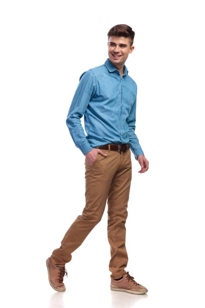 istock side view of a happy relaxed casual man walking 936000762