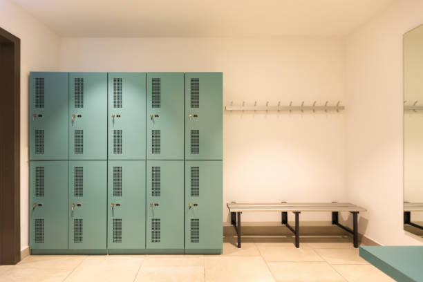 Dressing room with turquoise lockers Dressing room with turquoise lockers. Benches to change outfit. Nobody inside locker room stock pictures, royalty-free photos & images