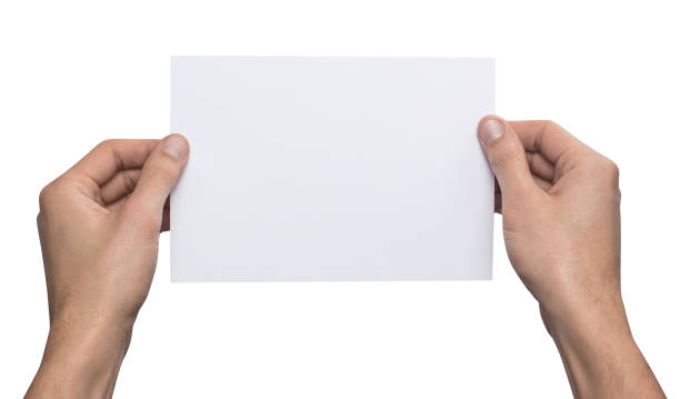 istock Mockup A5 letter horizontally empty blank white holds the man in his hand. Isolated on a white background 936003966