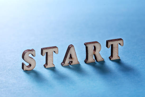 istock START from wooden letters on a blue background 936004246