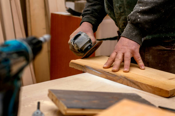 istock Carpenter working with wood and grinder 936011594