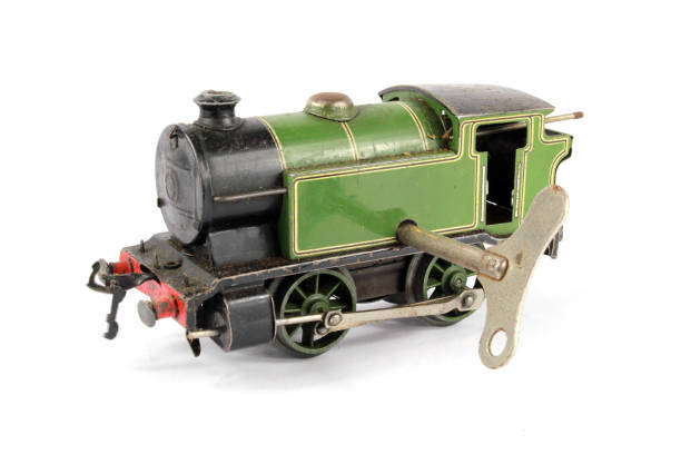 Toy Electric Model Train on White Background Toy Electric Model Train on White Background miniature train stock pictures, royalty-free photos & images