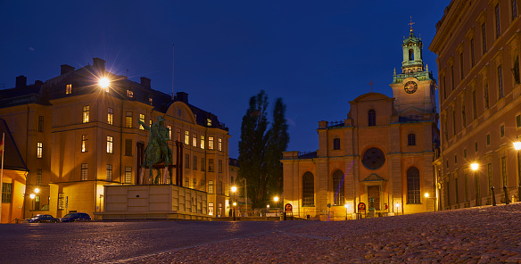 Stockholm, Sweden - August 29, 2017:  Night view of the Royal Palace (Stockholms slott) at Gamla Stan (the Old Town), Stadsholmen island.