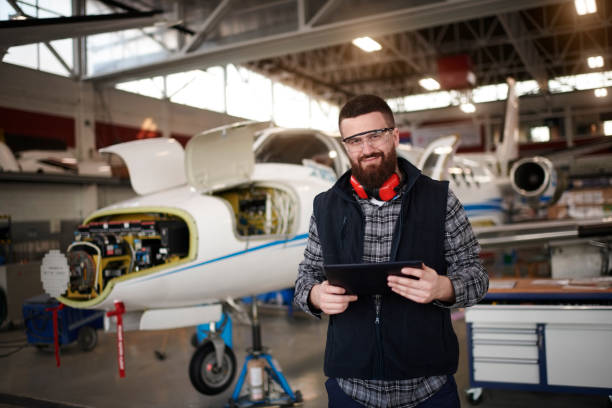istock Aircraft mechanic in the hangar 936037938