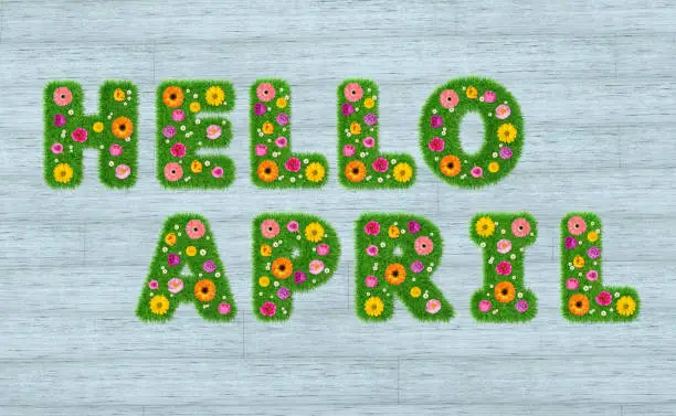 Photo of Hello April inscription from the letters of grass with flowers against a background of boards. 3D render.