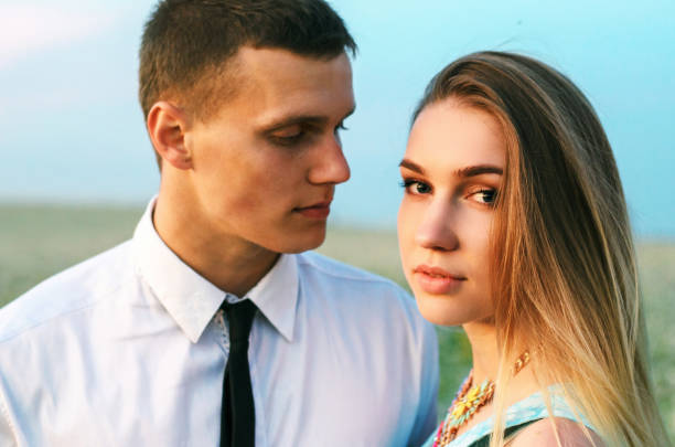 istock Romantic couple running in field 936062730