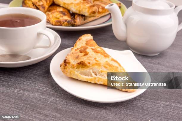 Delicious Golden Triangles Of Puff Pastry On The Table And A Cup Of Tea Top View Stock Photo - Download Image Now