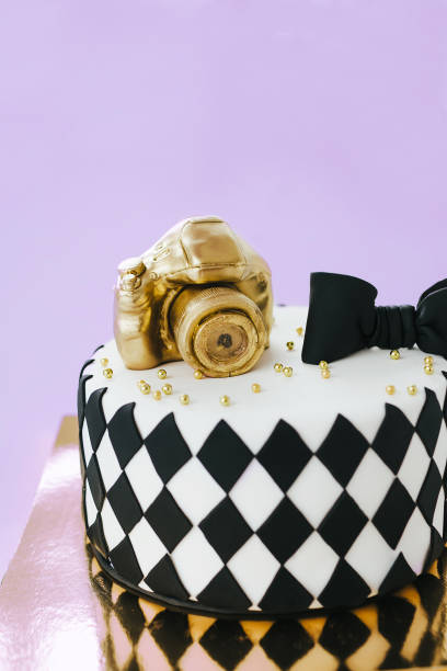 istock Black and White Birthday Cake For Photographer On Violet Background. 936078846