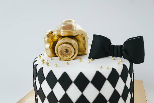 istock Black and White Birthday Cake For Photographer On White Background. 936078902