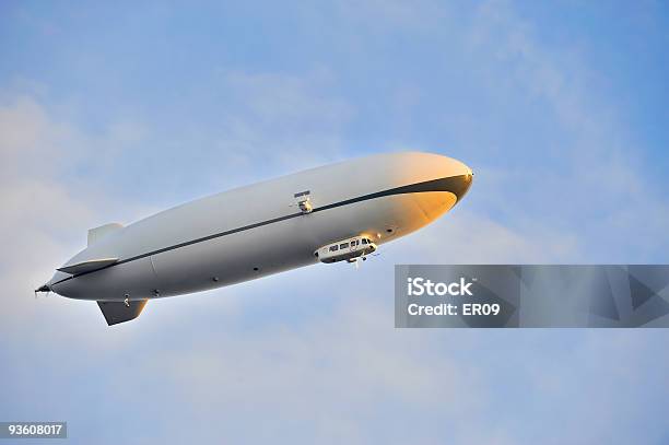 White Zeppelin Flying In The Blue Sky Stock Photo - Download Image Now - Blimp, Blue, Color Image