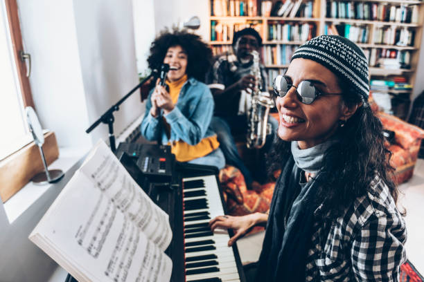 istock Young women playing music and singing 936081974