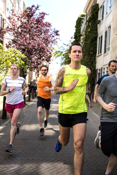 istock Urban runners crew training in the city 936082048
