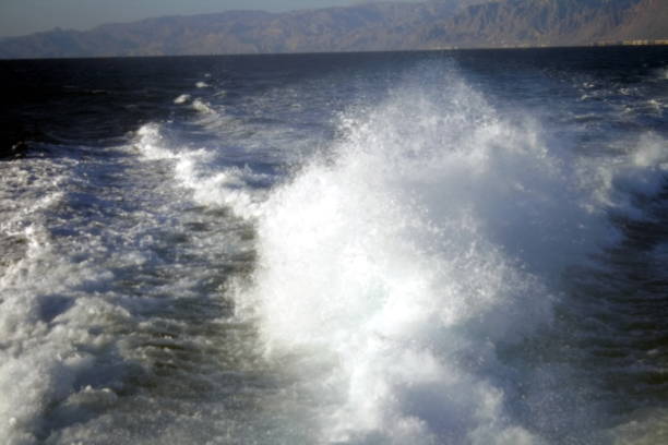 istock splashes of waves from the motor 936082764