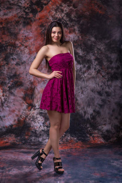 istock Attractive young woman studio portrait on marble colored background 936087544