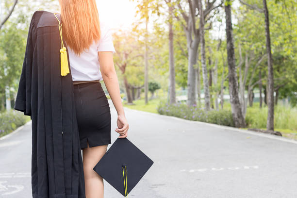 istock back of view graduate in garden 936092674