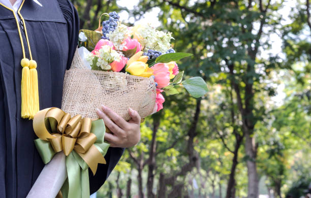 student graduate holding Flower bouquet in hand