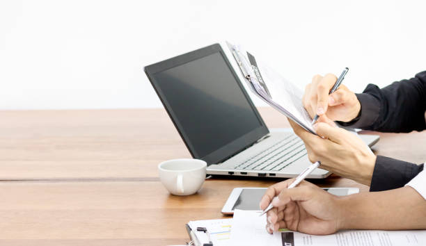 istock Talking about work in morning with laptop and coffe on desk 936092738