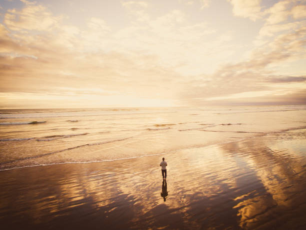 istock Walking on beach concept of hope. 936092766