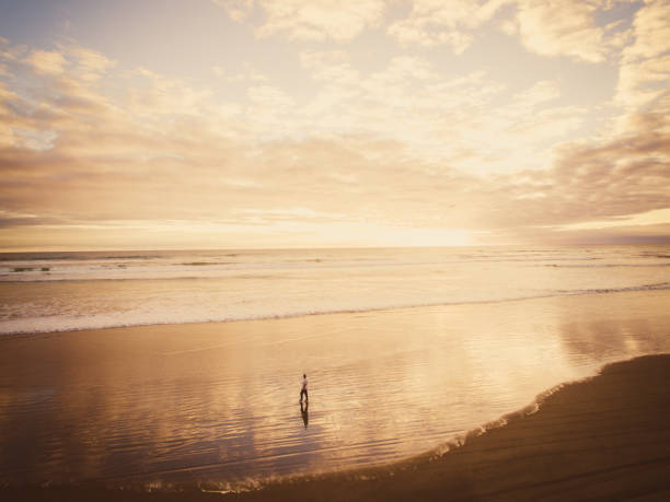 istock Walking on beach concept of hope. 936092770
