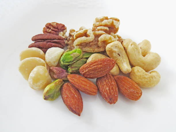 орехи - cashew beer nuts nut food стоковые фото и изображения