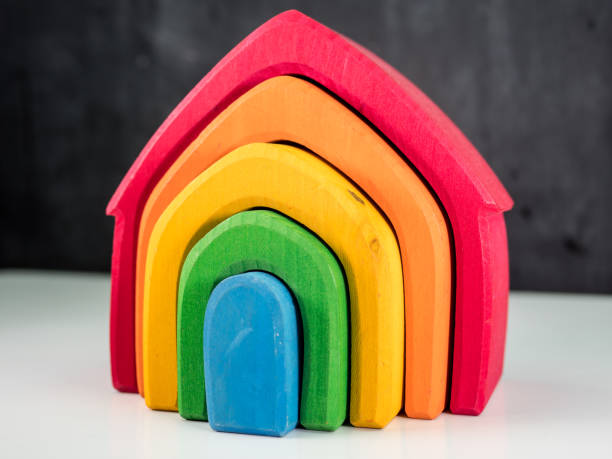 istock wooden toy house shapes 936098388