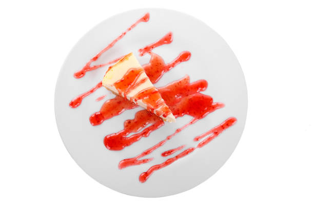 istock White cheesecake with berry topping, isolated 936105734