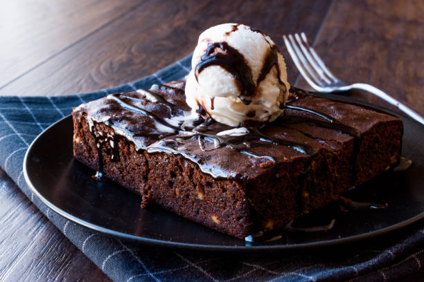 istock Chocolate Brownie with Ice Cream and Hazelnut Powder. 936105984