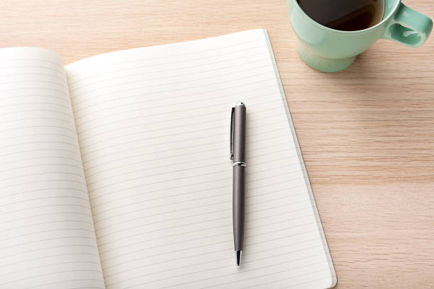 istock blank notebook with pencil on wooden desk 936113100