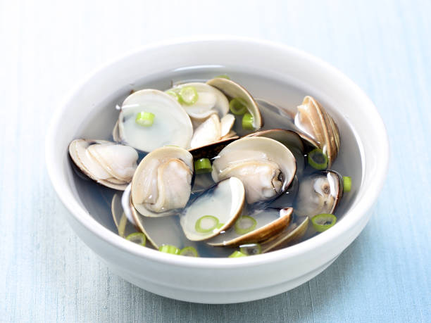 istock Clams soup cooked in a white pot in recipe 936113978