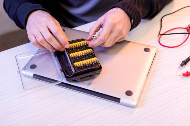 istock cropped image of hands and attachments to screwdriver over digital tablet 936114042