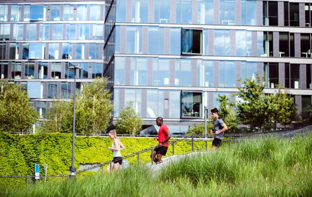 Young people in the city running together.