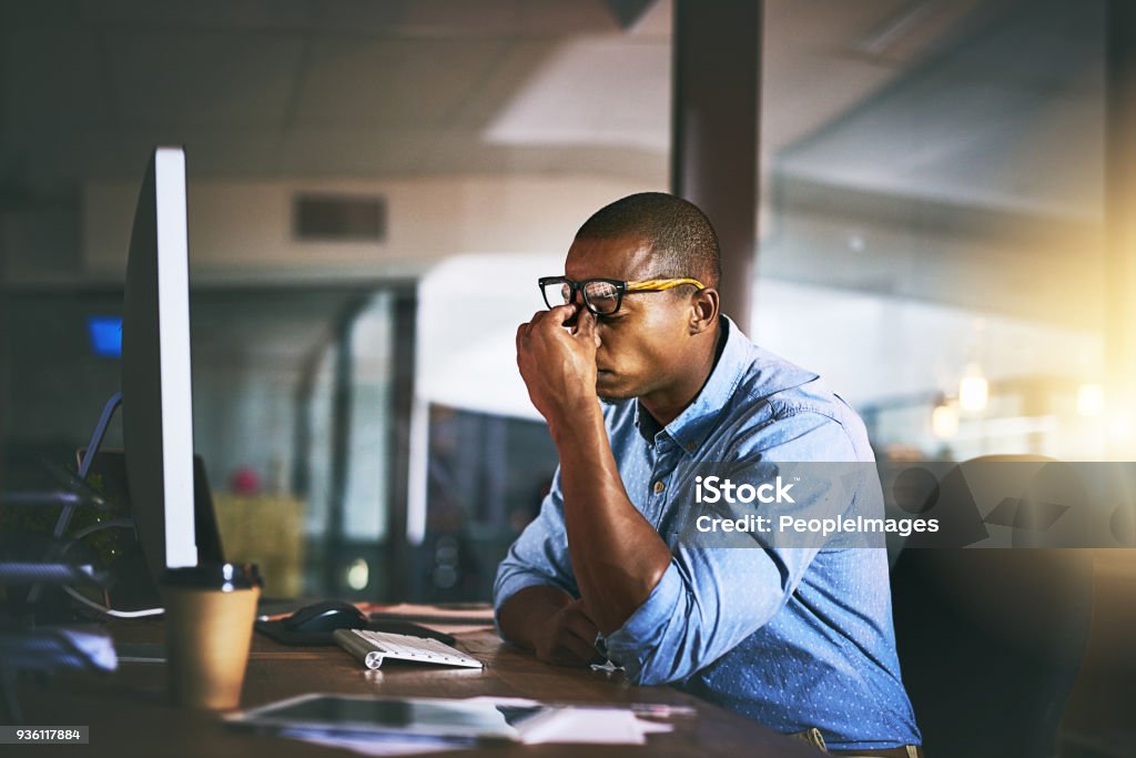 That’s it, I’m done! Shot of a young businessman experiencing stress during late night at work Emotional Stress Stock Photo