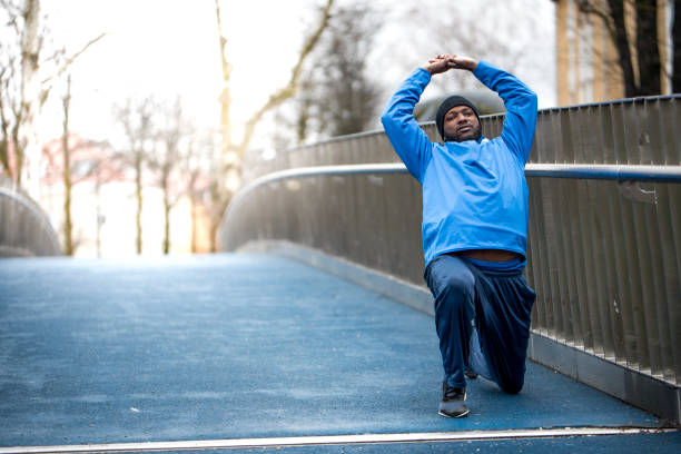 istock Man stretching outdoors 936121862