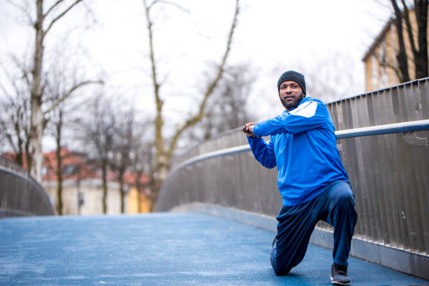 istock Man stretching outdoors 936121884