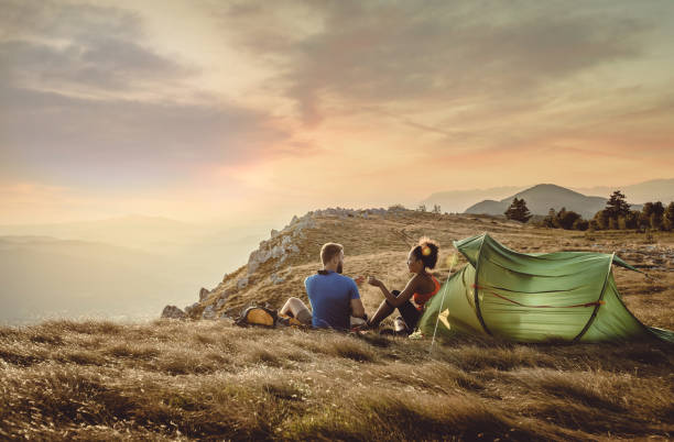 istock Couple Resting on Top of Hill 936122000