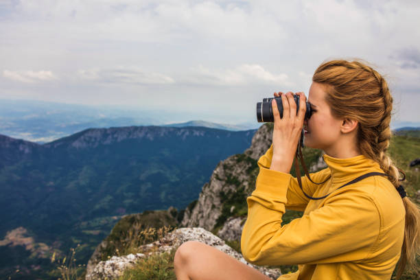 istock Woman hiking alone in the mountains 936128306